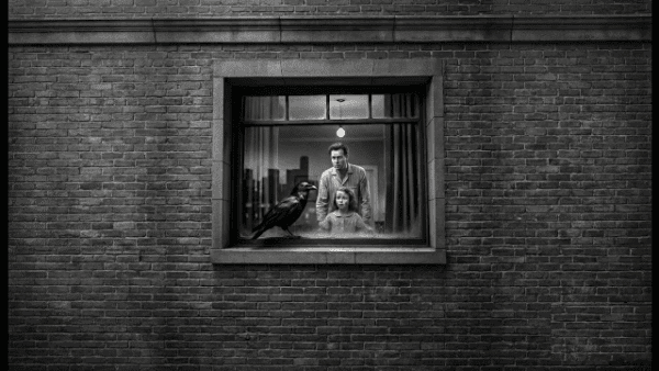 A jet black raven perches on a windowsill in front of a man and little girl. Noir